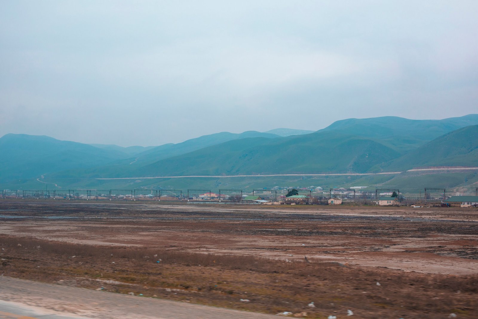 View of a town across mountains View of a town across mountains. High quality photo